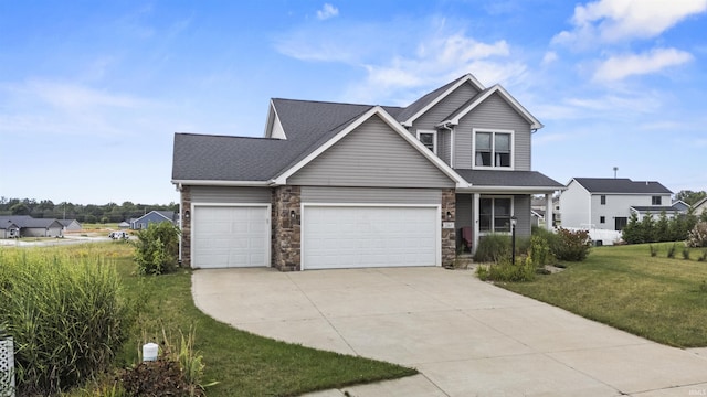 view of front of property with a front lawn, stone siding, and driveway