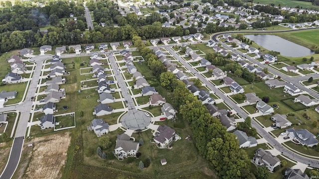 aerial view with a residential view and a water view