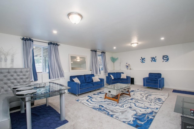 carpeted living area with recessed lighting