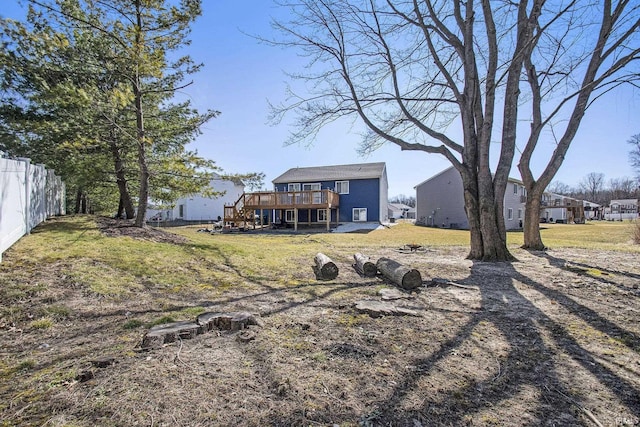 view of yard with fence and a wooden deck