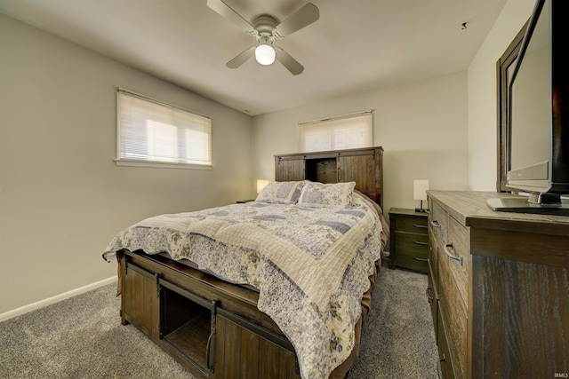 bedroom featuring dark colored carpet, baseboards, and ceiling fan