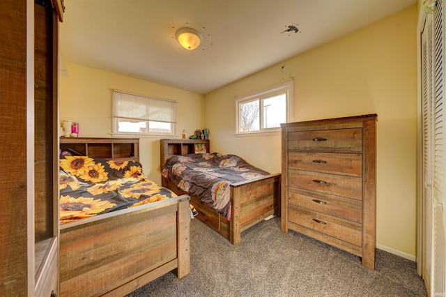 bedroom with baseboards and carpet flooring