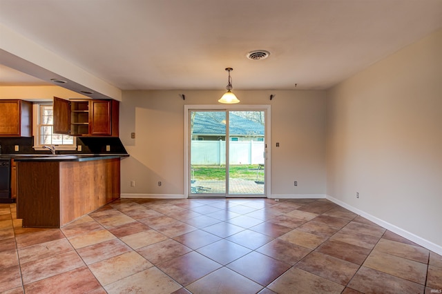 kitchen with visible vents, open shelves, dark countertops, black dishwasher, and a peninsula