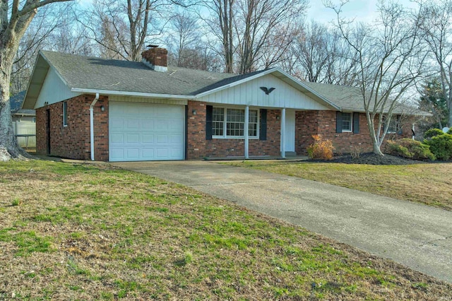 ranch-style house with a front yard, a chimney, concrete driveway, a garage, and brick siding