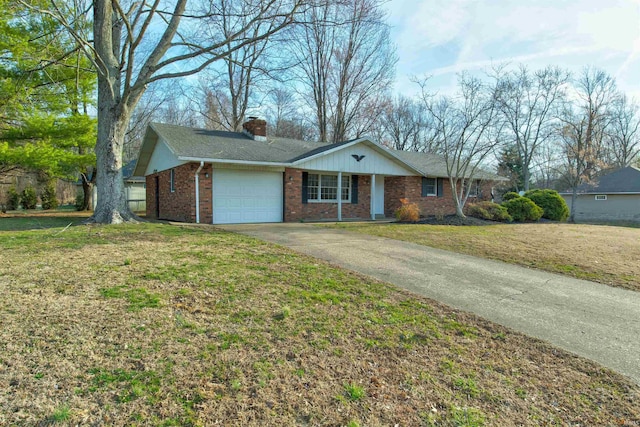 ranch-style house with a front yard, driveway, an attached garage, a chimney, and brick siding