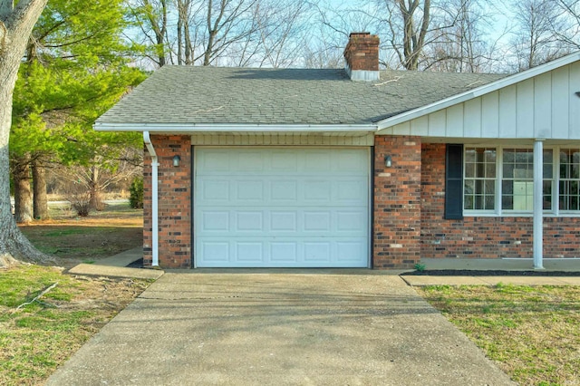 garage with concrete driveway