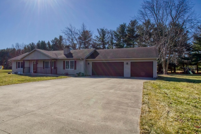 single story home with a chimney, a garage, concrete driveway, and a front yard