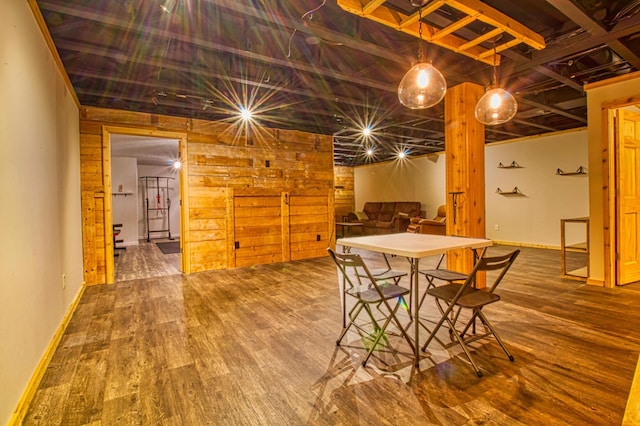 dining area featuring baseboards and wood finished floors