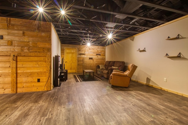 basement featuring wood finished floors and baseboards