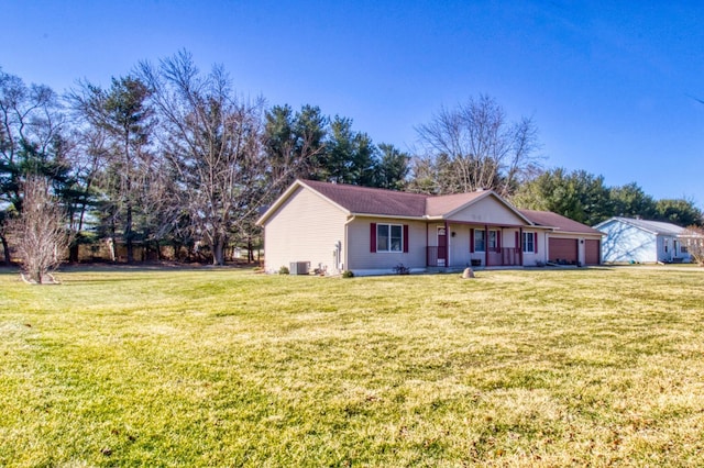 ranch-style home with a front yard, central AC, and an attached garage