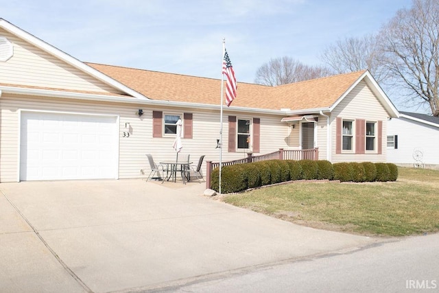 single story home with an attached garage, roof with shingles, concrete driveway, and a front lawn