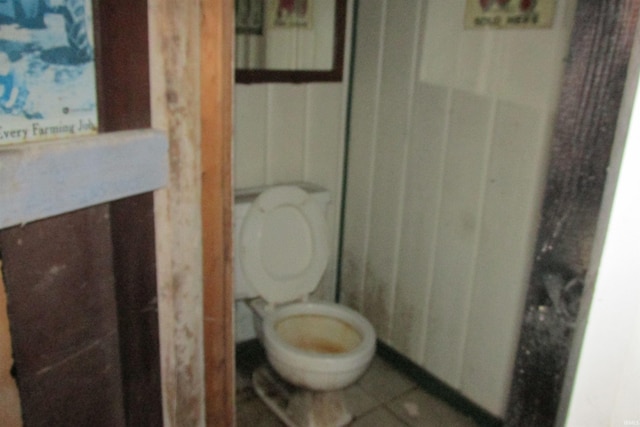 bathroom featuring tile patterned floors and toilet