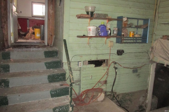 interior space featuring wooden walls