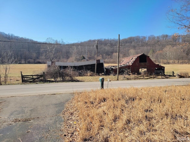 mountain view featuring a rural view