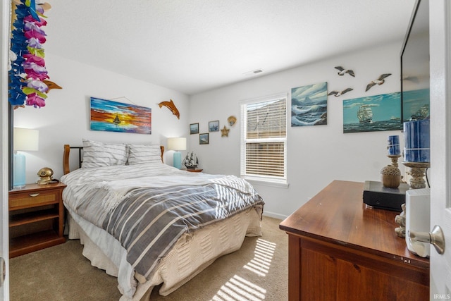 carpeted bedroom with visible vents