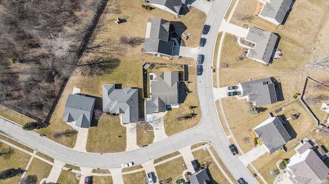 birds eye view of property with a residential view