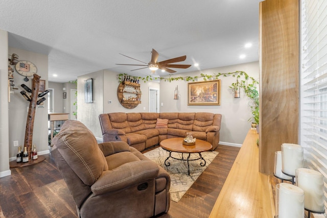 living area with recessed lighting, a ceiling fan, baseboards, and wood finished floors