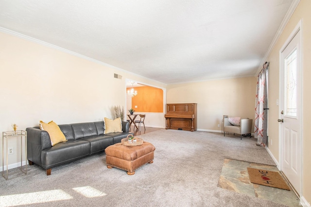 carpeted living area featuring a chandelier, visible vents, and ornamental molding