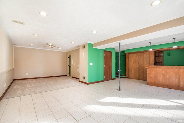 unfurnished living room featuring visible vents, recessed lighting, ceiling fan, and ornamental molding