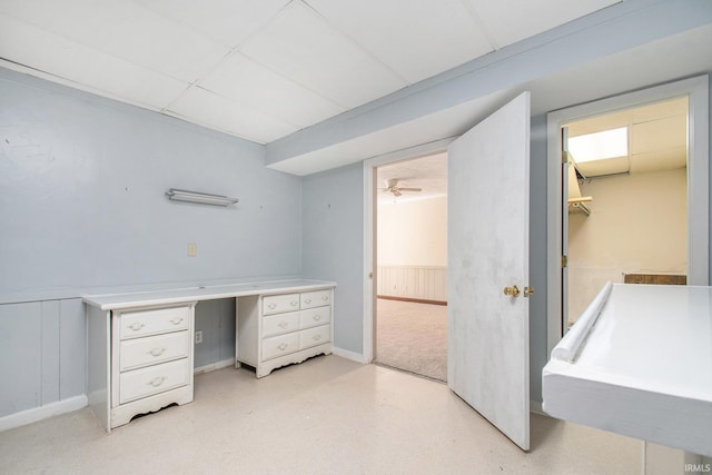 interior space with wainscoting and a paneled ceiling