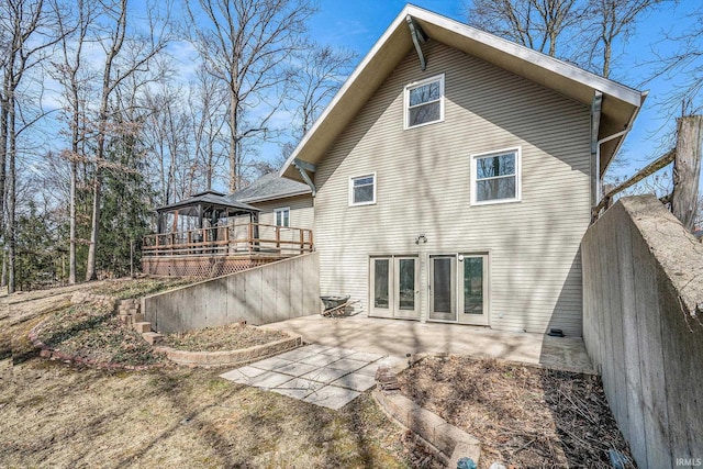 rear view of property with a gazebo and a patio