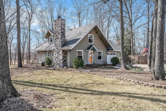 view of front facade featuring a front lawn, a garage, roof with shingles, and a chimney