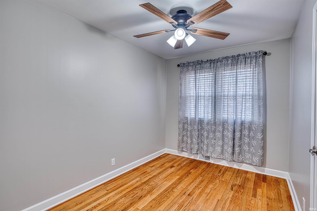 empty room with visible vents, baseboards, a ceiling fan, and light wood finished floors