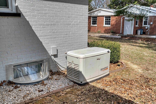 exterior details featuring brick siding and a power unit