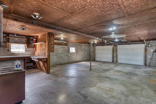 garage featuring concrete block wall