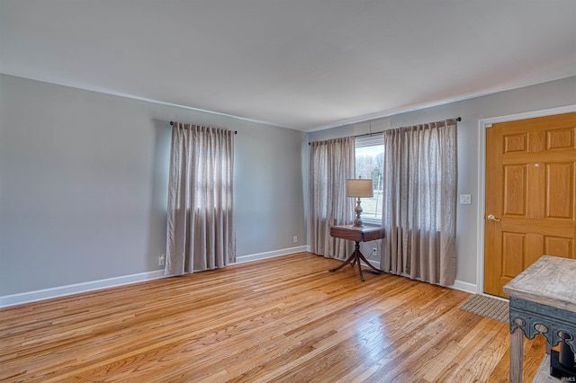 entryway featuring light wood-type flooring and baseboards