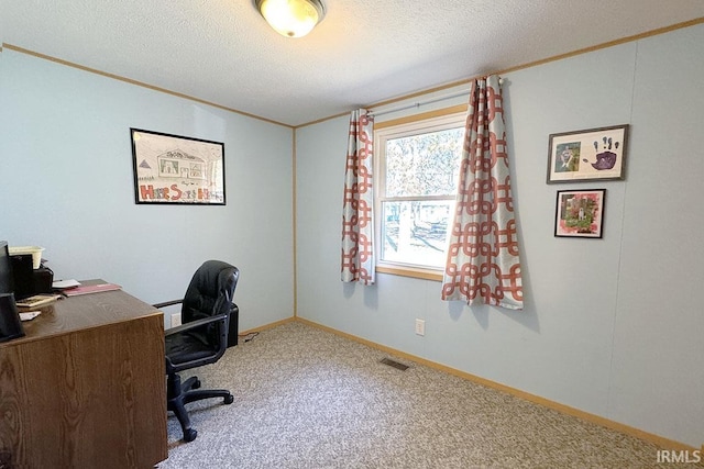 home office with visible vents, baseboards, ornamental molding, carpet floors, and a textured ceiling