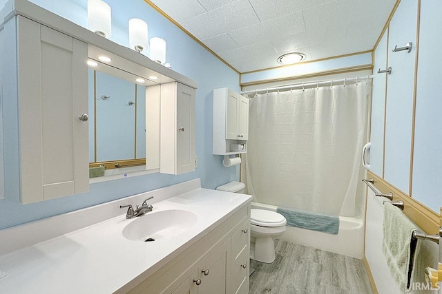 full bath with crown molding, toilet, shower / tub combo, wood finished floors, and vanity