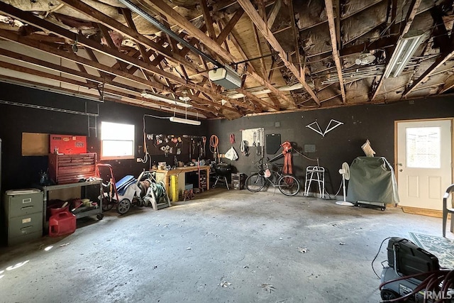 garage featuring a workshop area and a garage door opener