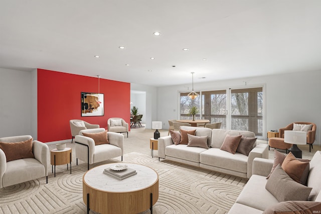 living room featuring recessed lighting and light colored carpet