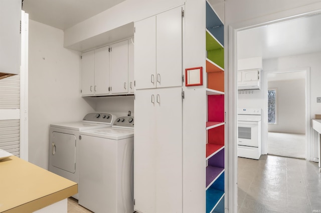 laundry area featuring cabinet space and separate washer and dryer