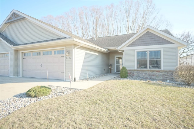 ranch-style home with a front yard, a shingled roof, concrete driveway, a garage, and stone siding