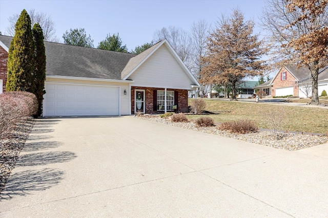 view of front of house with a garage, brick siding, roof with shingles, and concrete driveway