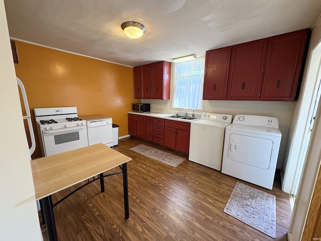 washroom with laundry area, dark wood-style floors, separate washer and dryer, and a sink