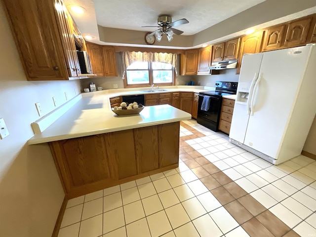 kitchen with a peninsula, a sink, white refrigerator with ice dispenser, black range with electric stovetop, and under cabinet range hood