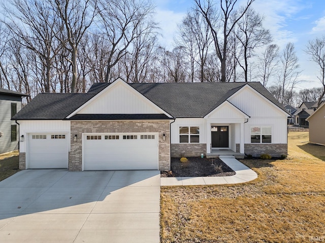 view of front of house with brick siding, an attached garage, roof with shingles, and driveway