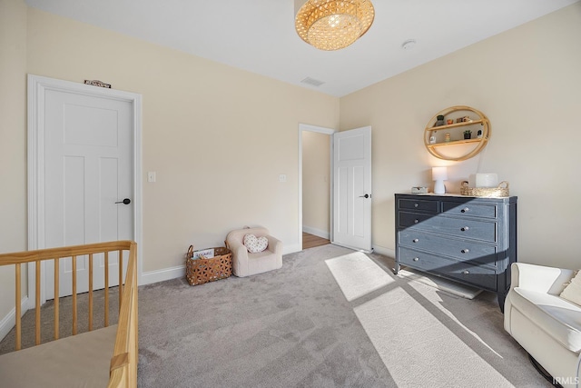 bedroom with baseboards, carpet floors, and visible vents