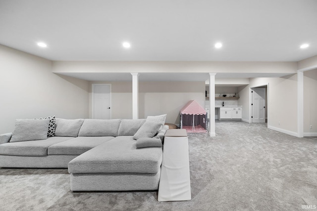 living room featuring recessed lighting, carpet, and baseboards