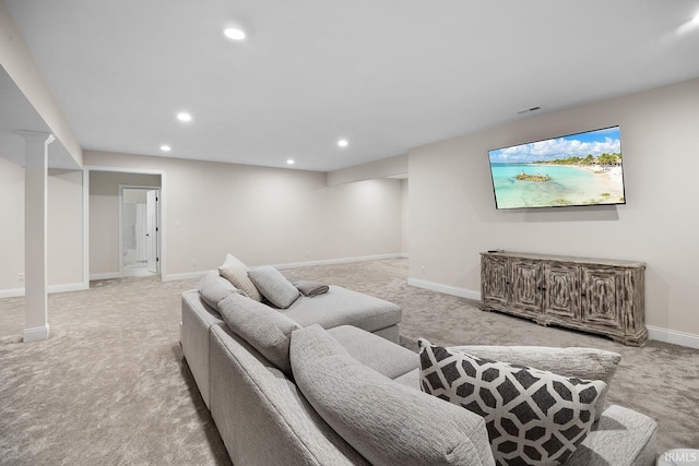 living area featuring recessed lighting, baseboards, and light colored carpet