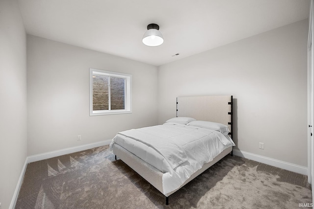 bedroom with baseboards and carpet floors