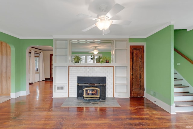 unfurnished living room with stairway, wood finished floors, and visible vents