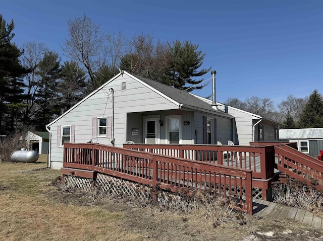 back of property with a deck