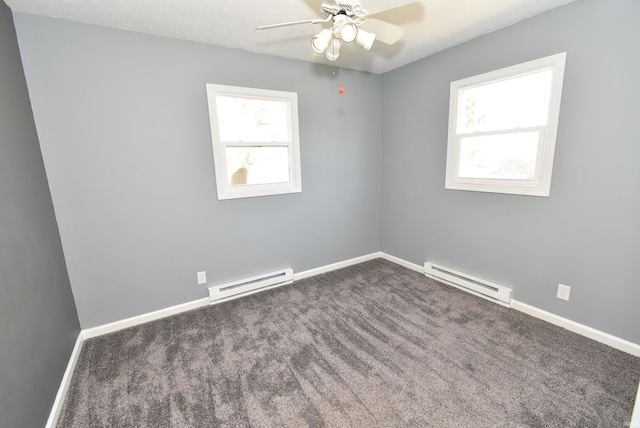 carpeted spare room featuring a baseboard radiator, baseboards, and ceiling fan