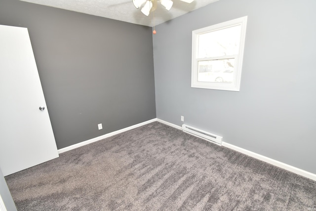 spare room featuring baseboards, carpet floors, baseboard heating, and ceiling fan