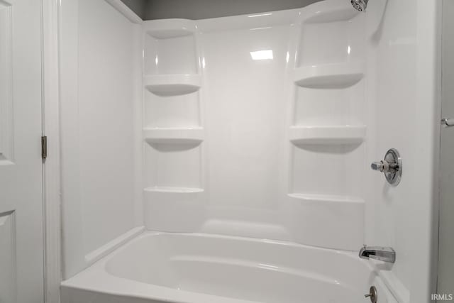 bathroom with bathing tub / shower combination