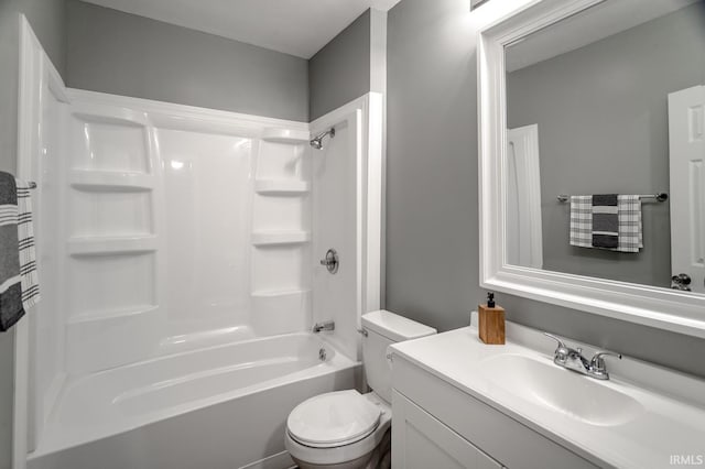 full bath featuring tub / shower combination, toilet, and vanity